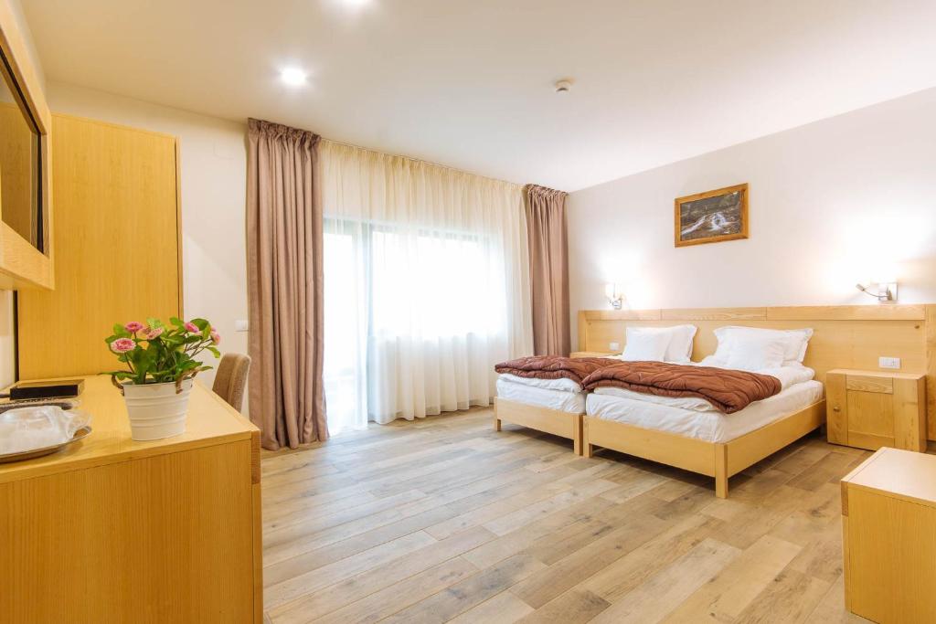 Postel nebo postele na pokoji v ubytování Comoara Rarăului