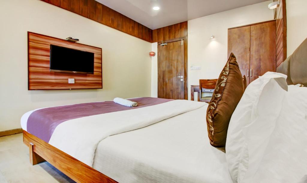 Postel nebo postele na pokoji v ubytování Hotel Shree Daan