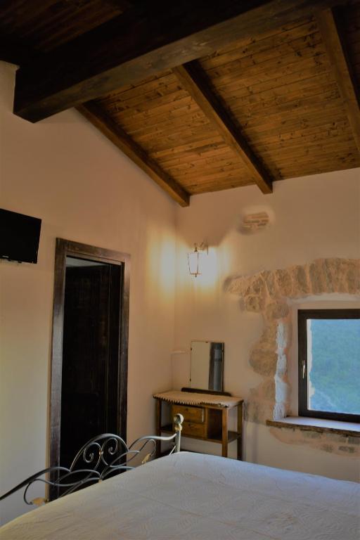 Letto o letti in una camera di B&B Le Fate
