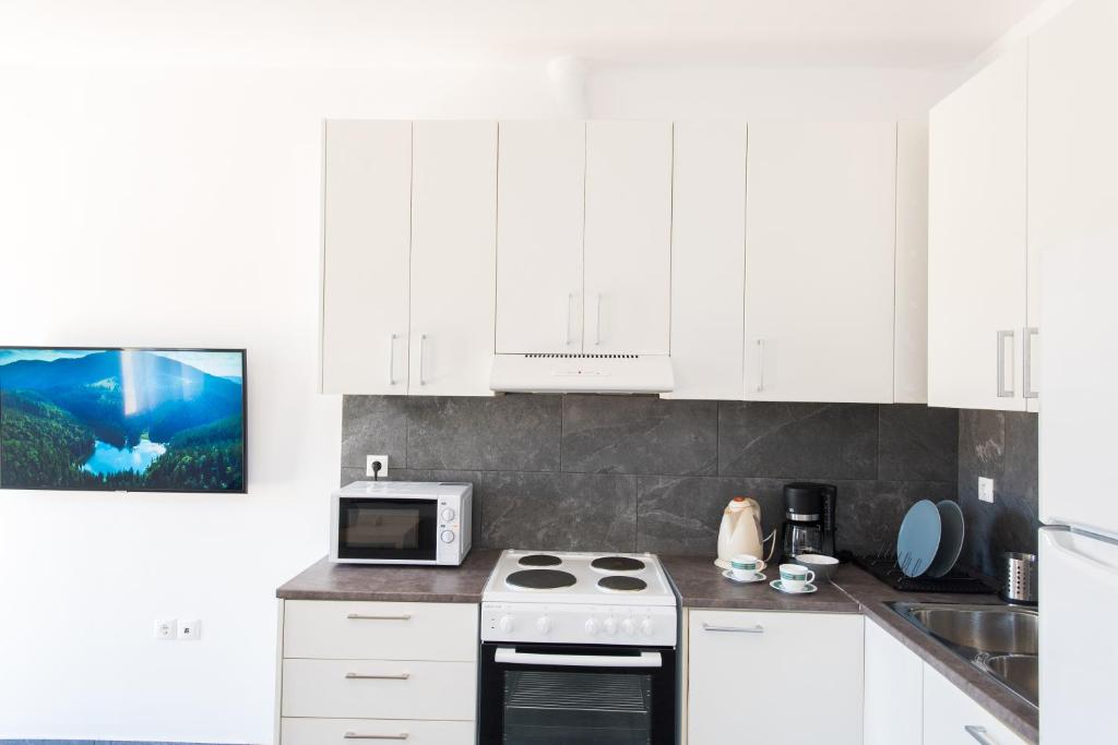 Kuchyň nebo kuchyňský kout v ubytování A&A House Mykonos B