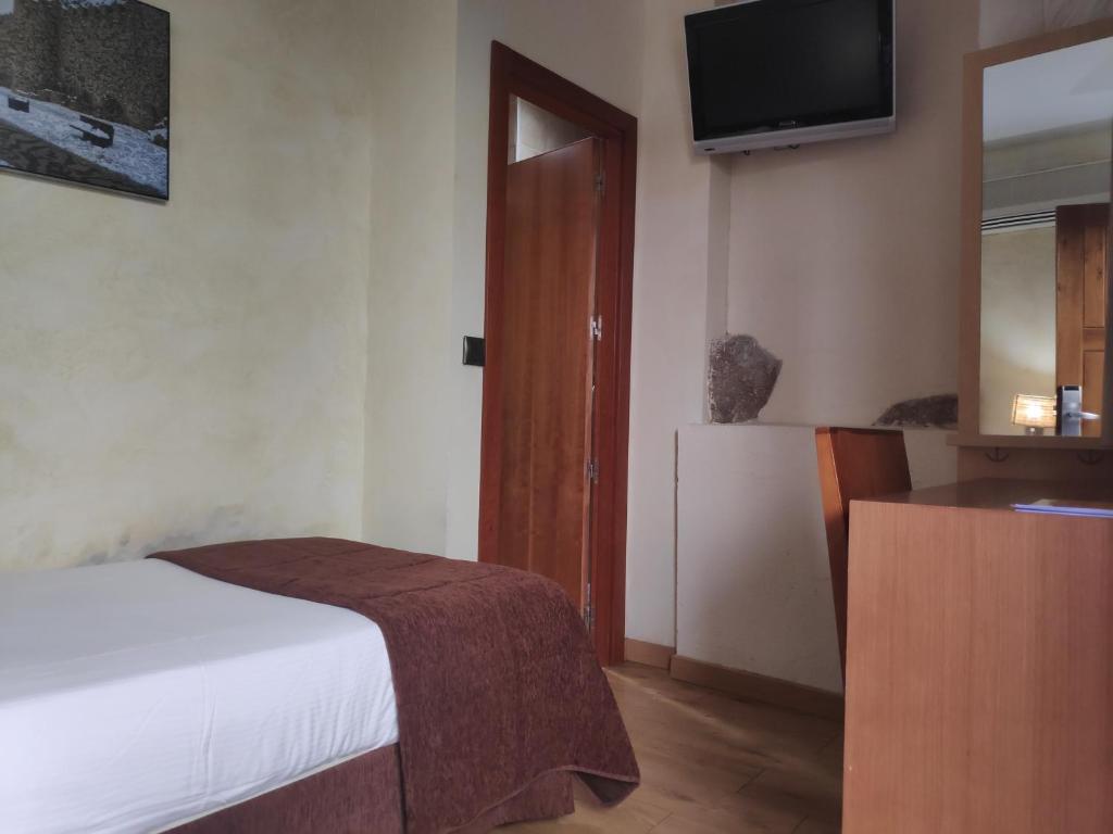 Postel nebo postele na pokoji v ubytování Hotel Las Leyendas