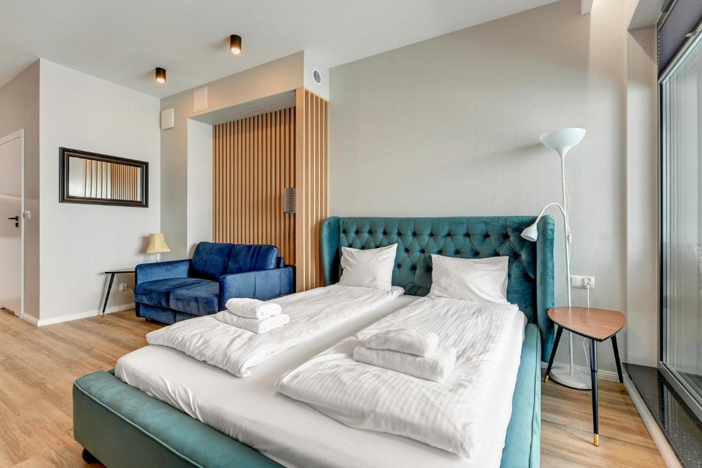 Posteľ alebo postele v izbe v ubytovaní Granaria Comfort Apartments