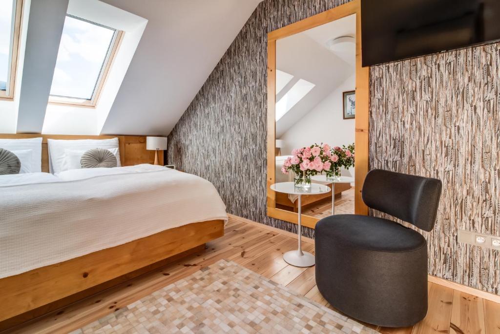Postel nebo postele na pokoji v ubytování Hotel Na Rozcestí