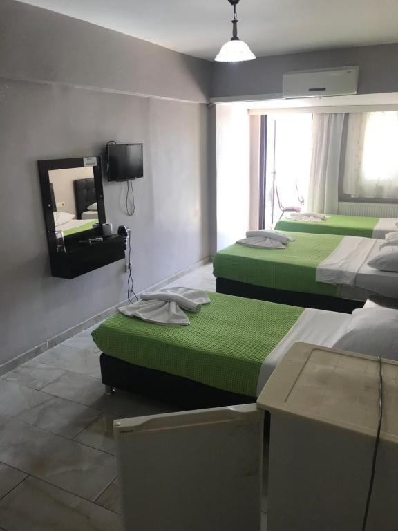 Postel nebo postele na pokoji v ubytování Anatolia Hotel