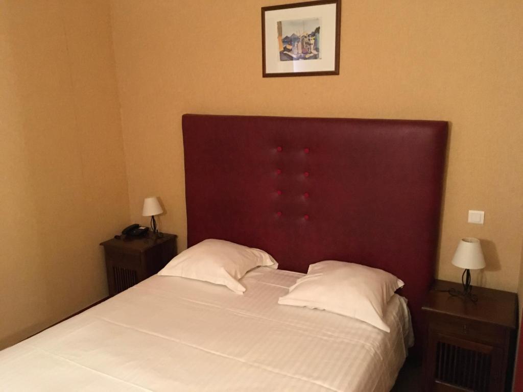 Postel nebo postele na pokoji v ubytování Hotel Dorele