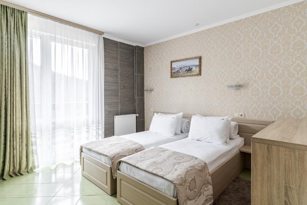 Postel nebo postele na pokoji v ubytování Hotel Adrenalin