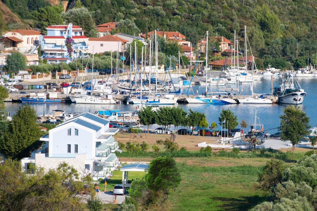 a group of boats docked at a marina at Notia Luxury Living in Porto Koufo