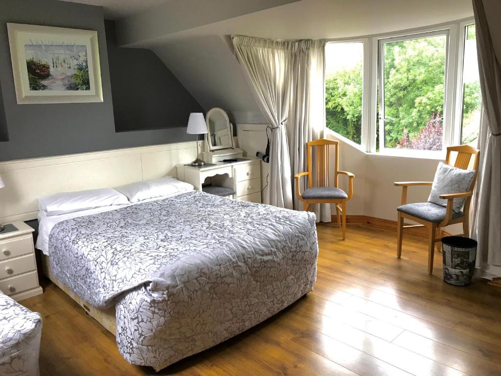 Postel nebo postele na pokoji v ubytování Grove Lodge B&B