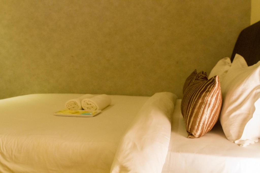 Postel nebo postele na pokoji v ubytování Mood Hotel
