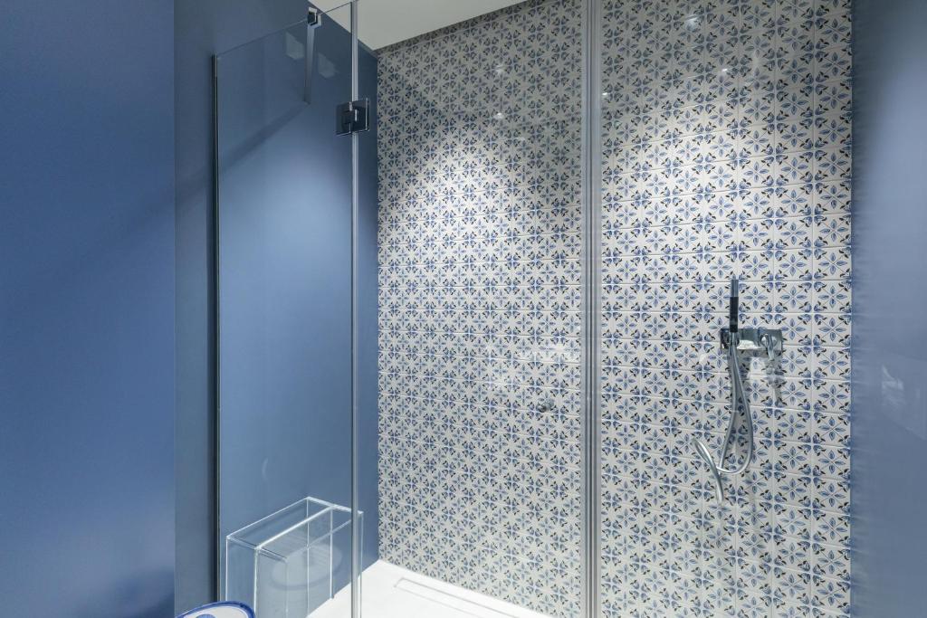 a bathroom with a shower with a glass door at Santa Caterina - Dimora sul mare in Polignano a Mare