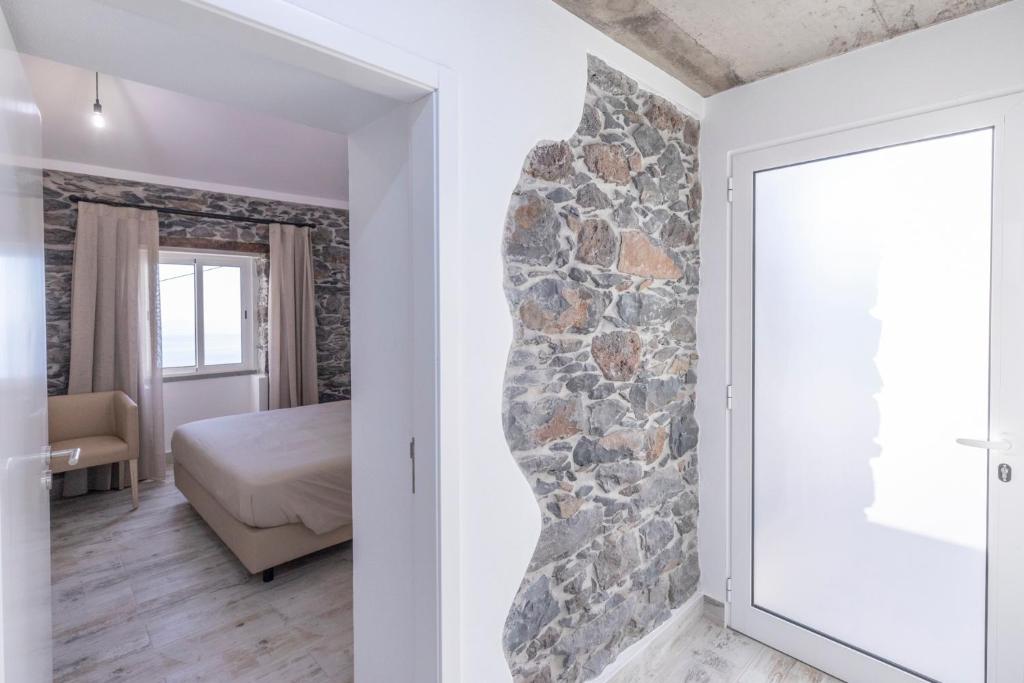 Postel nebo postele na pokoji v ubytování Rosinhas House