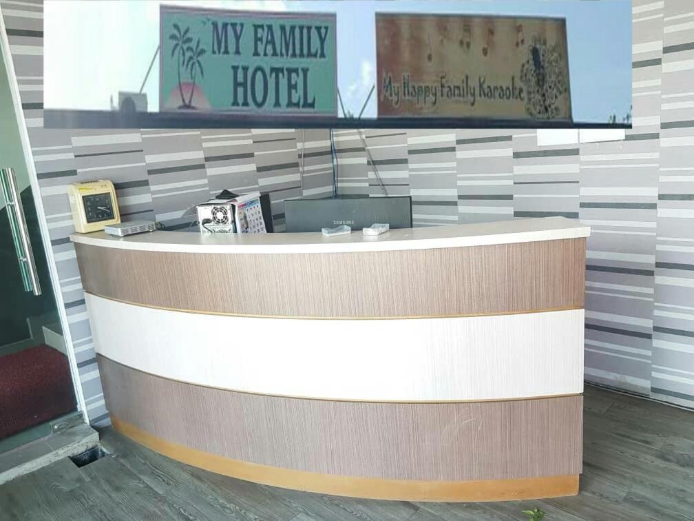 a lobby of a hotel with a reception counter at My Family Hotel in Port Dickson