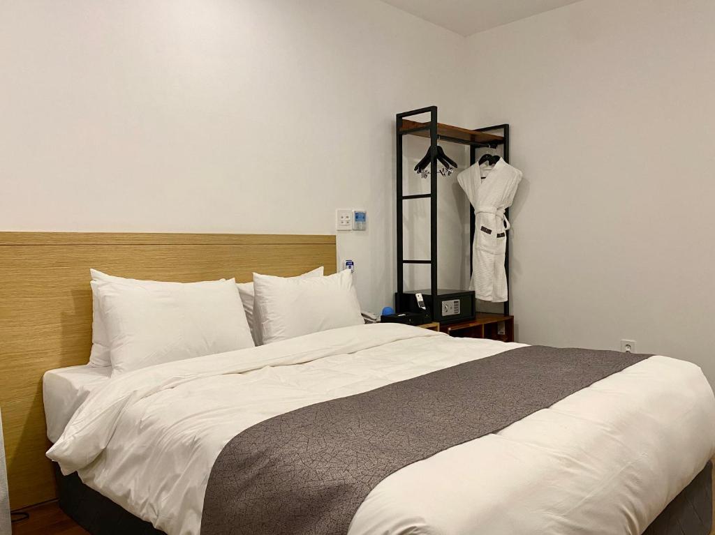 Postel nebo postele na pokoji v ubytování Hotel Noblestay