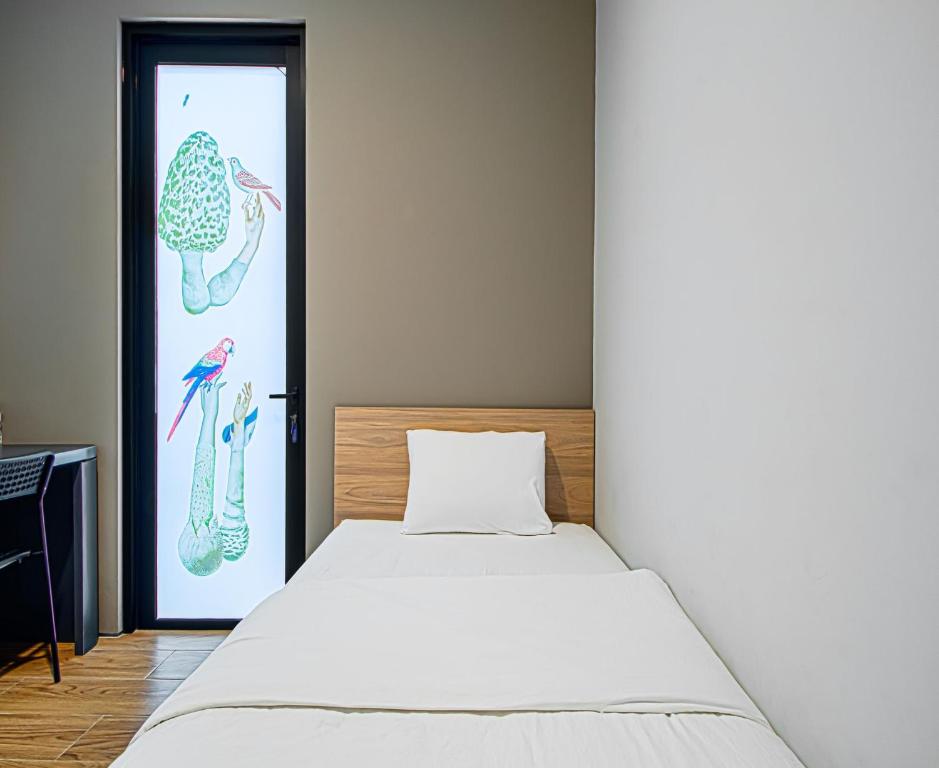 Postel nebo postele na pokoji v ubytování M Studio Karawaci