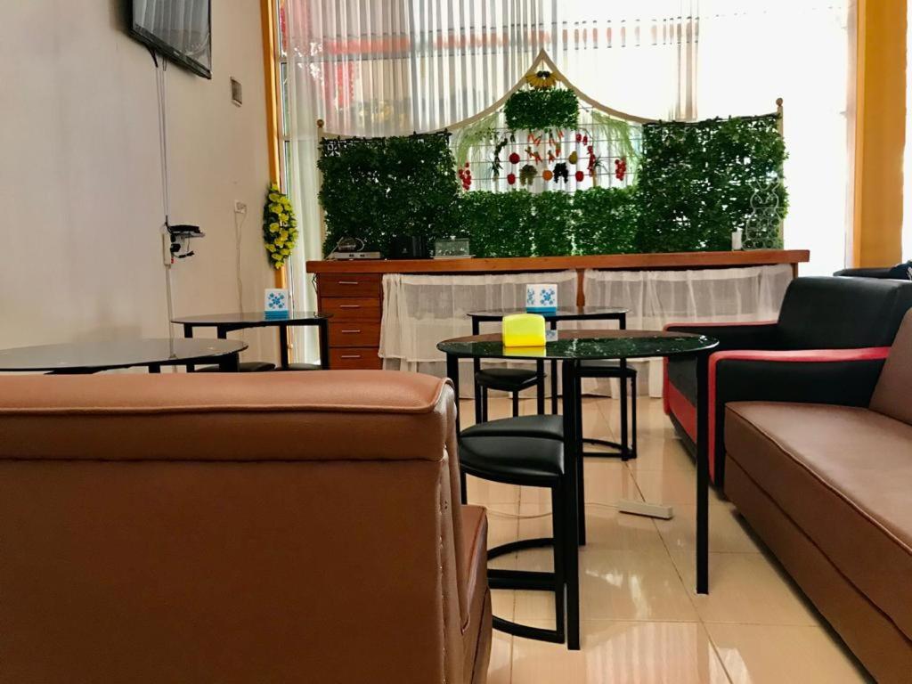 TV a/nebo společenská místnost v ubytování Penginapan Intan Bandara