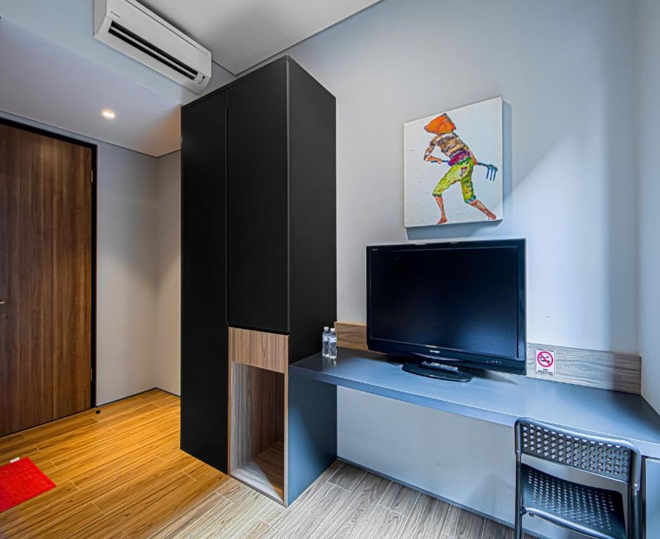 TV a/nebo společenská místnost v ubytování M Studio Karawaci