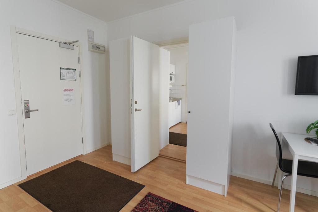 TV a/nebo společenská místnost v ubytování Slagsta Gate Hotell