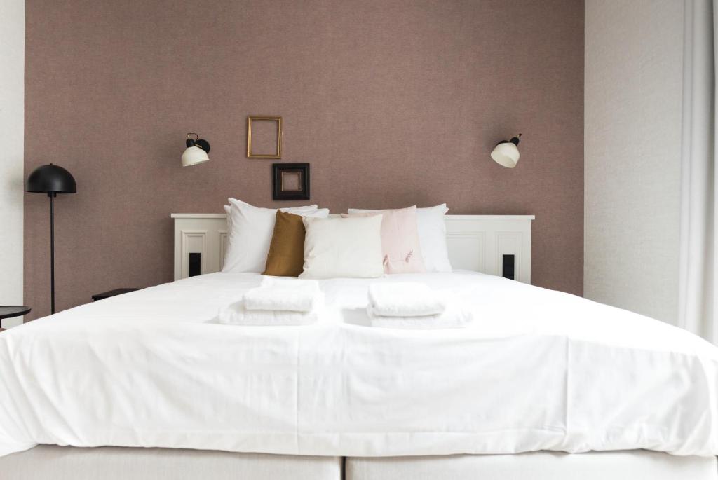 Postel nebo postele na pokoji v ubytování Ysbrantsz Boutique Hotel