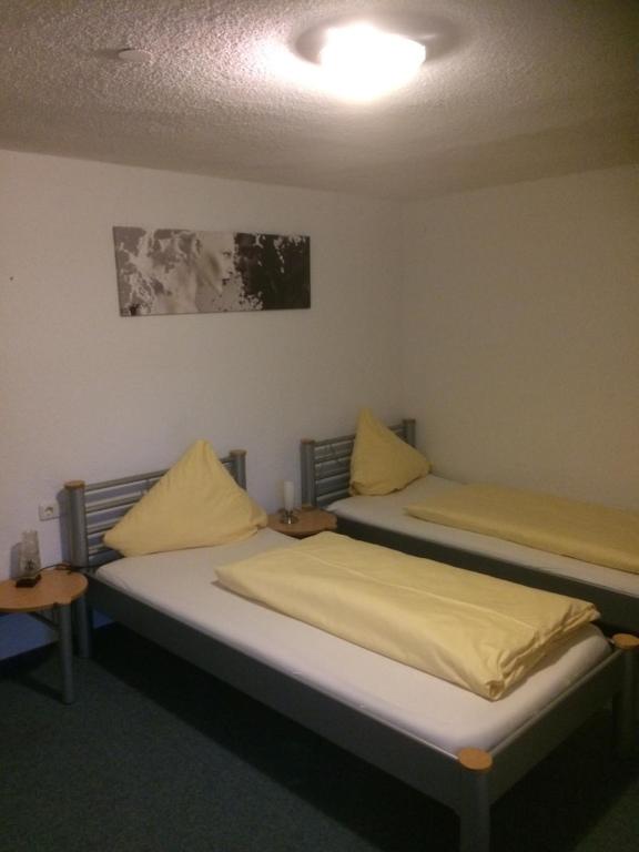 Postel nebo postele na pokoji v ubytování Holzgauerhof