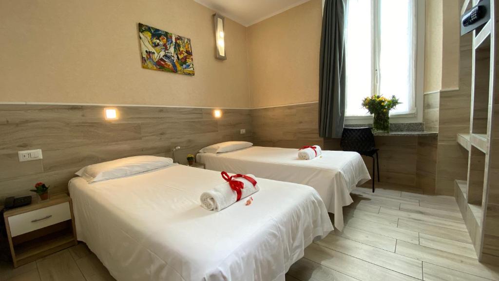 Łóżko lub łóżka w pokoju w obiekcie Eurohotel
