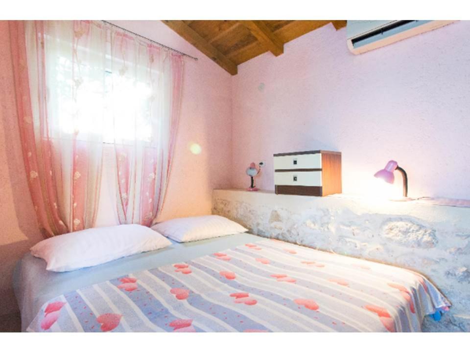Ένα ή περισσότερα κρεβάτια σε δωμάτιο στο Ciklama Apartment
