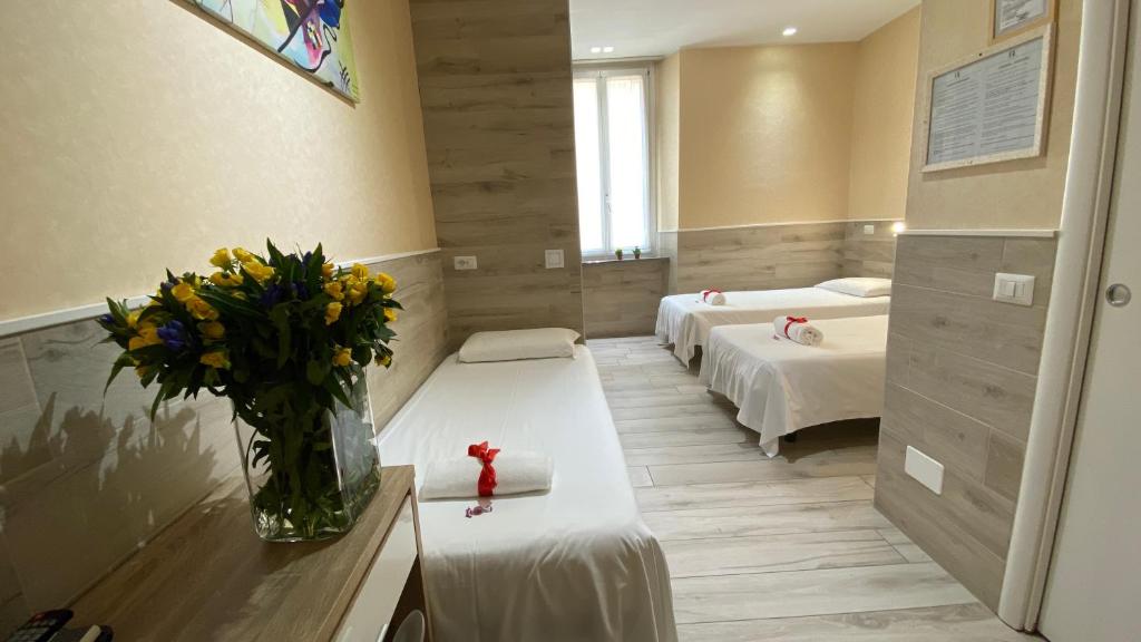 Łóżko lub łóżka w pokoju w obiekcie Eurohotel