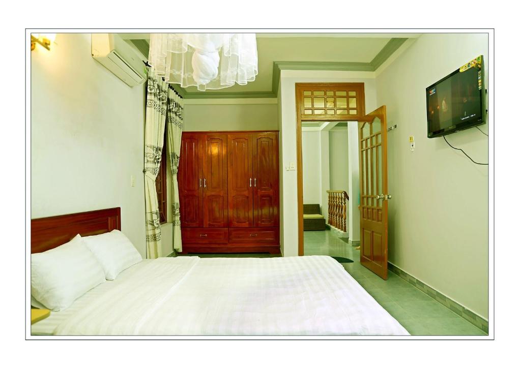 Postel nebo postele na pokoji v ubytování Hai Dang Homestay