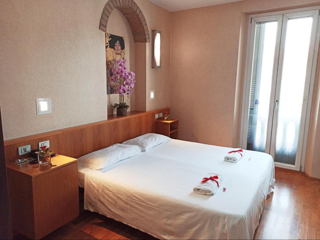 Łóżko lub łóżka w pokoju w obiekcie Eurohotel
