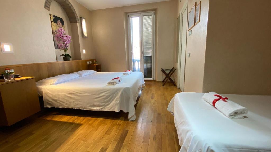 Łóżko lub łóżka w pokoju w obiekcie Eurohotel
