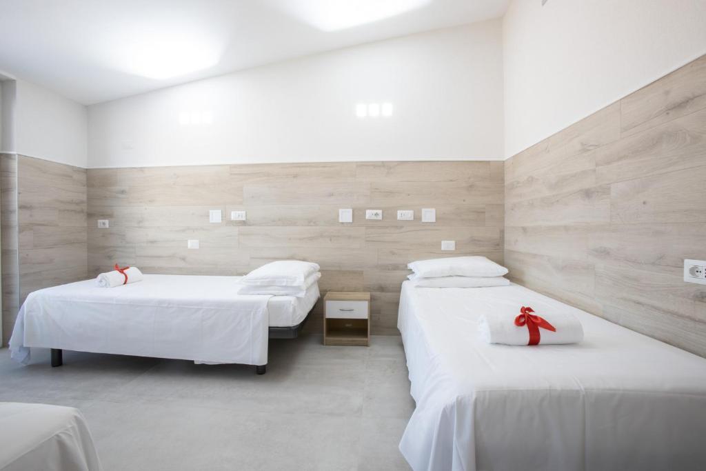 Łóżko lub łóżka w pokoju w obiekcie Eurohotel
