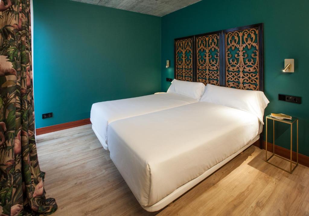 A bed or beds in a room at Eira Gundián