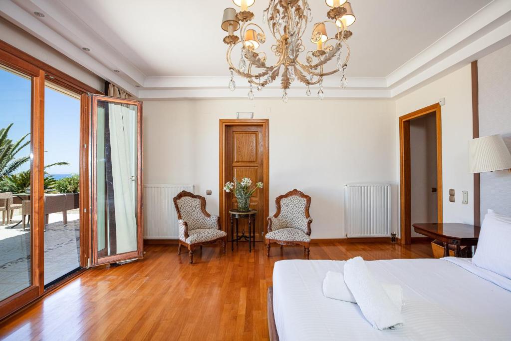 Postel nebo postele na pokoji v ubytování Palm Hill Villa