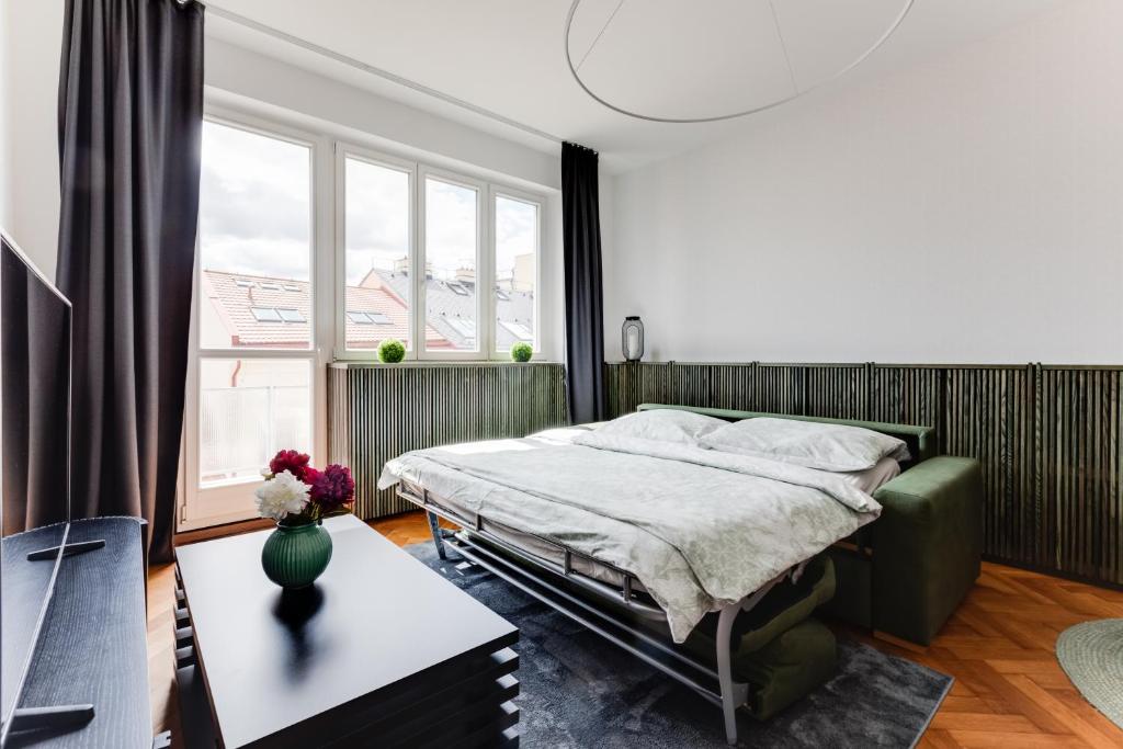 Łóżko lub łóżka w pokoju w obiekcie Apartment Petrska