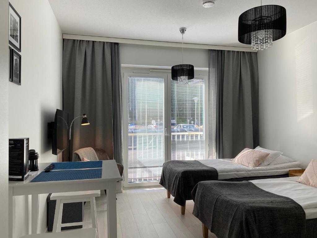 Postel nebo postele na pokoji v ubytování Time Apartments Ylistönmäki