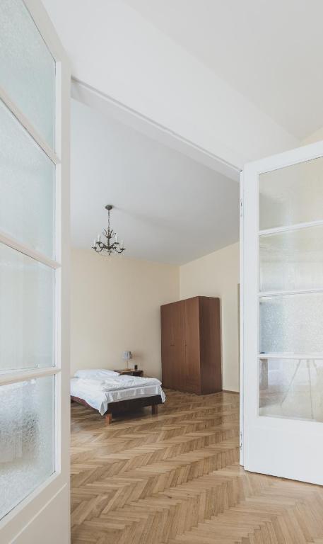 Postel nebo postele na pokoji v ubytování Cybulskiego Guest Rooms