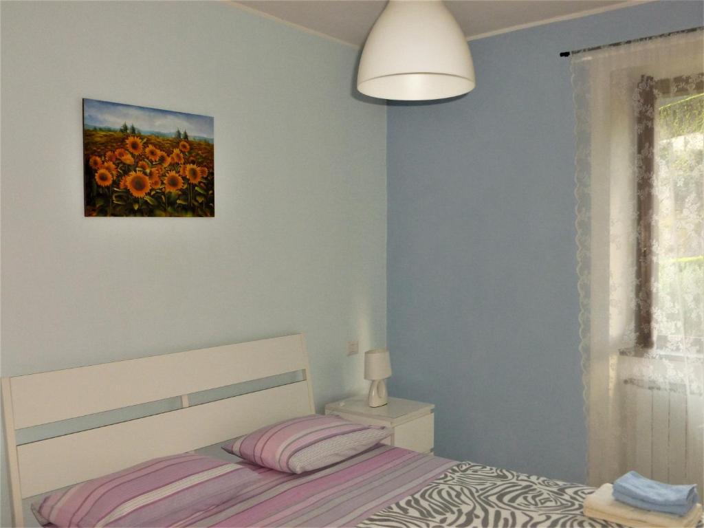 Postel nebo postele na pokoji v ubytování Hortus Lake Orta