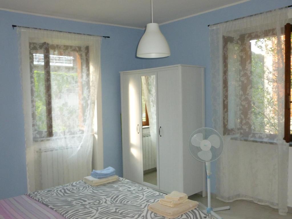 Postel nebo postele na pokoji v ubytování Hortus Lake Orta