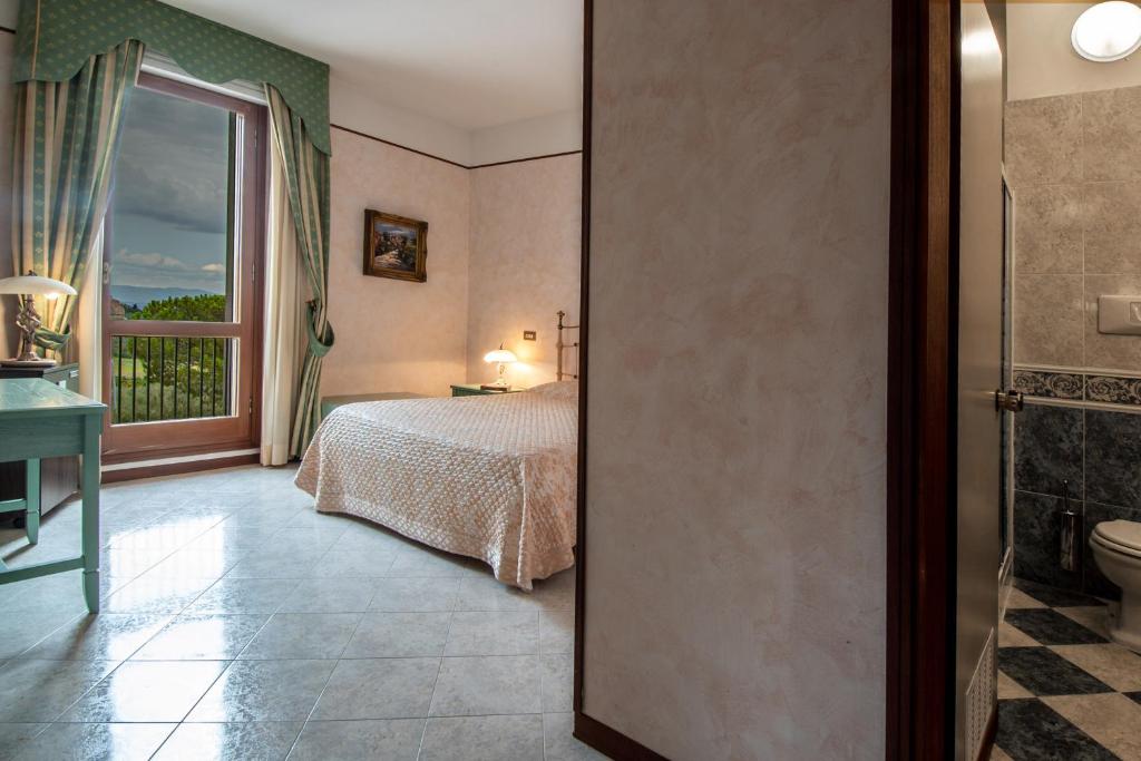 Postel nebo postele na pokoji v ubytování Fortuna Resort
