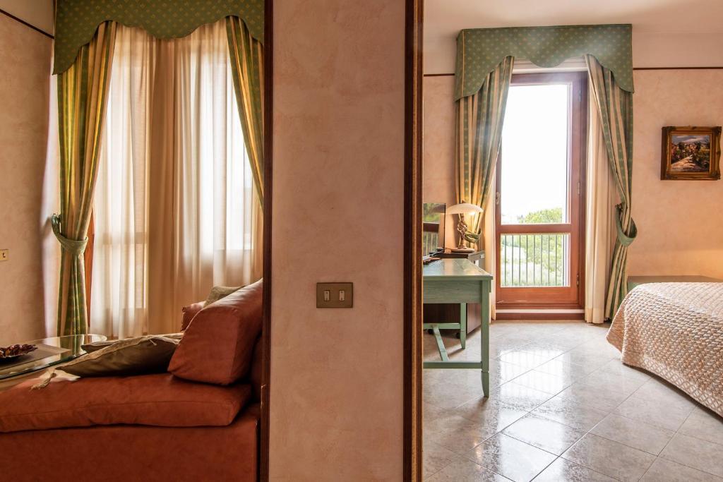 Postel nebo postele na pokoji v ubytování Fortuna Resort