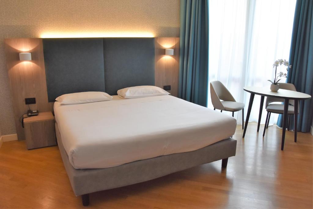 Postel nebo postele na pokoji v ubytování Hotel Motel Prestige