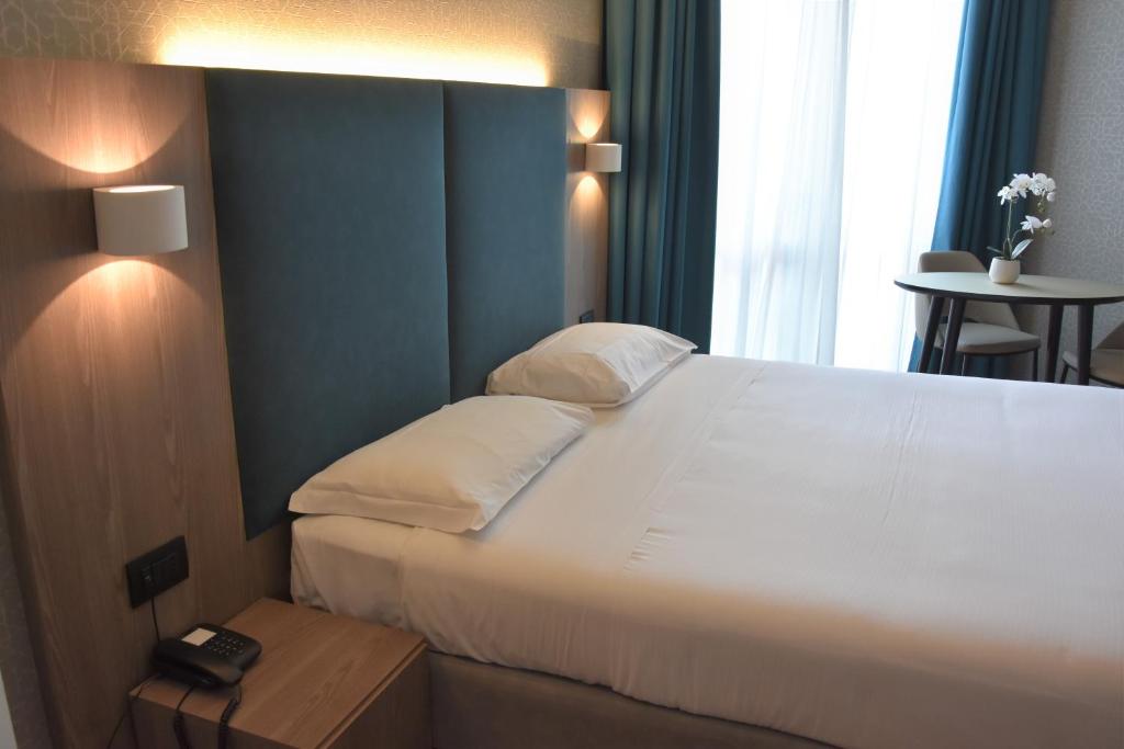 Postel nebo postele na pokoji v ubytování Hotel Motel Prestige