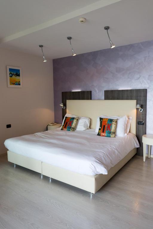 Postel nebo postele na pokoji v ubytování Hotel L'Approdo