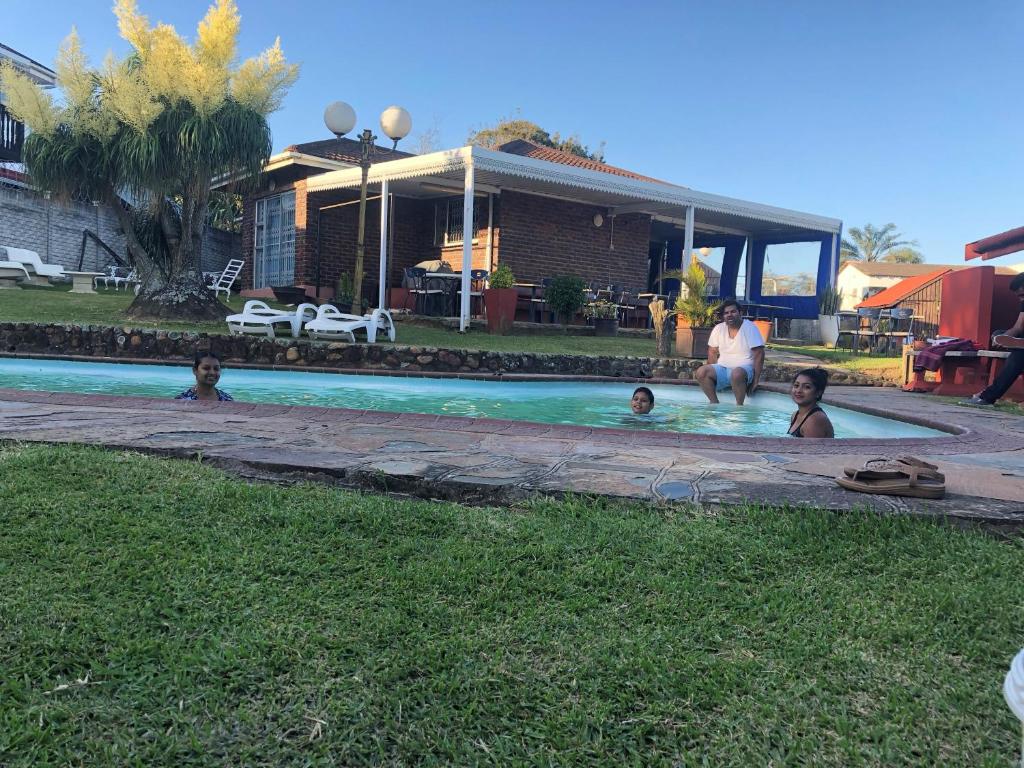 a group of people in a swimming pool at Bed and Breakfast at Eves in Durban