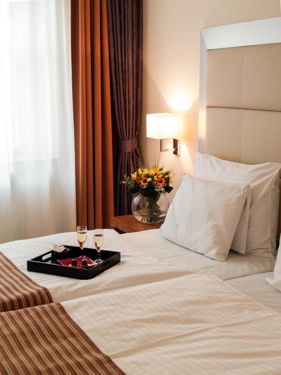 Postel nebo postele na pokoji v ubytování Design Merrion Hotel