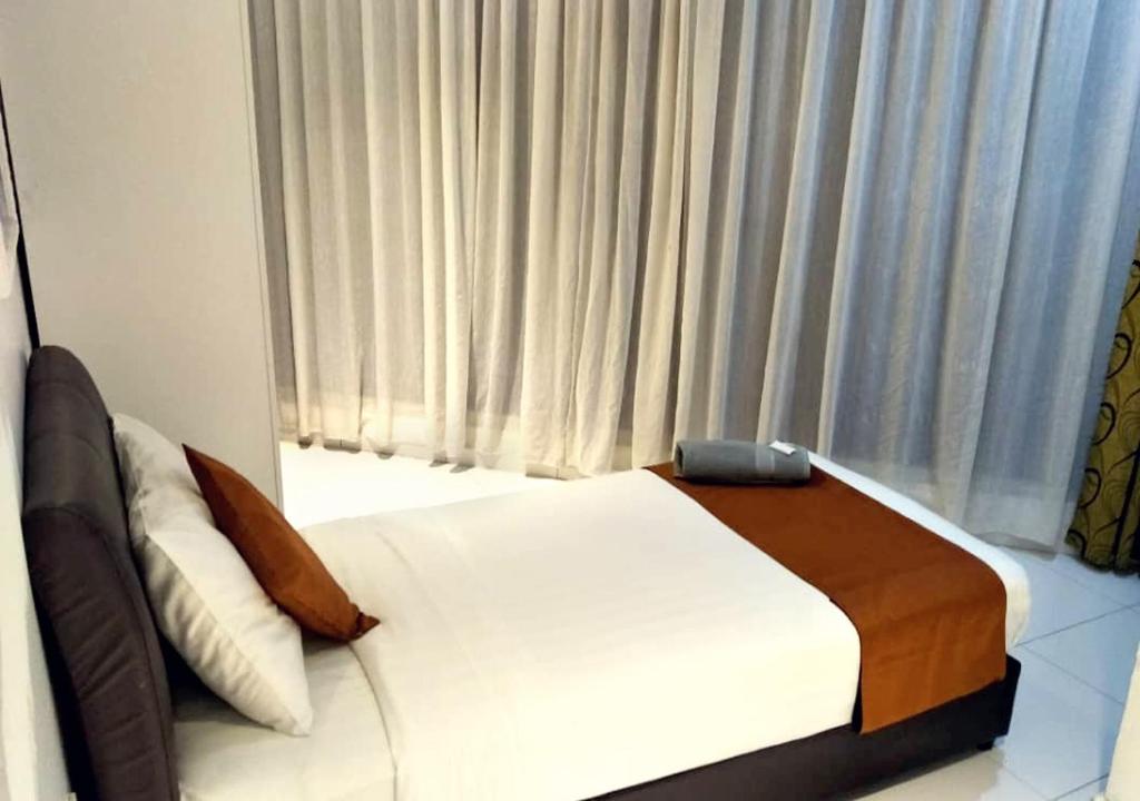 Postel nebo postele na pokoji v ubytování Hotel EC Double Star KLIA 1-KLIA 2
