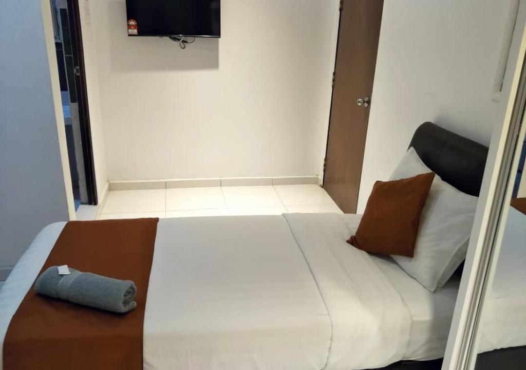 Postel nebo postele na pokoji v ubytování Hotel EC Double Star KLIA 1-KLIA 2
