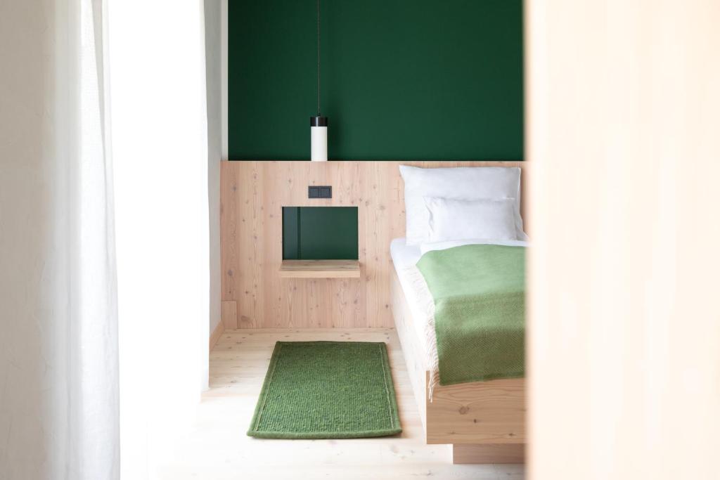 Postel nebo postele na pokoji v ubytování Hotel Neusacherhof