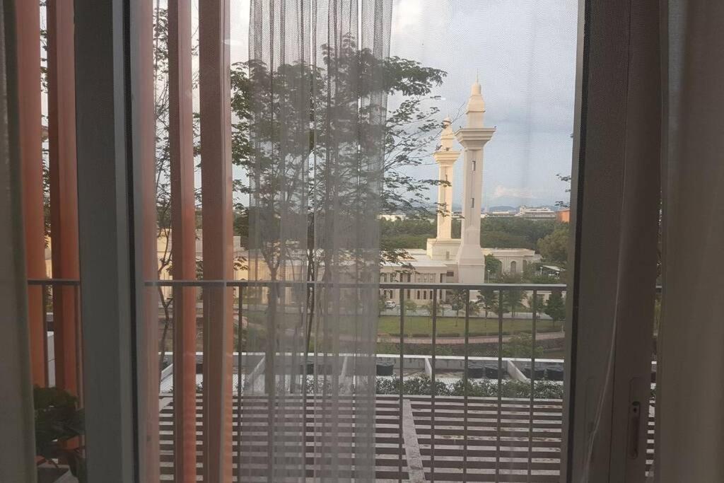 a window with a view of a building at Private studio at Bukit Jelutong in Shah Alam