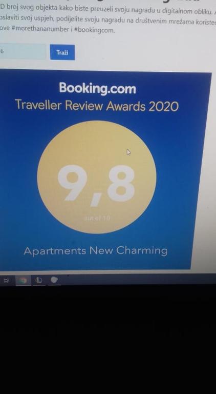 a computer screen with a sign on a website at Apartments New Charming in Senj