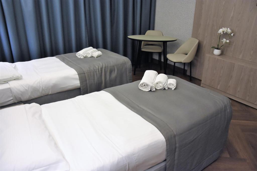 Postel nebo postele na pokoji v ubytování Hotel Motel Prestige